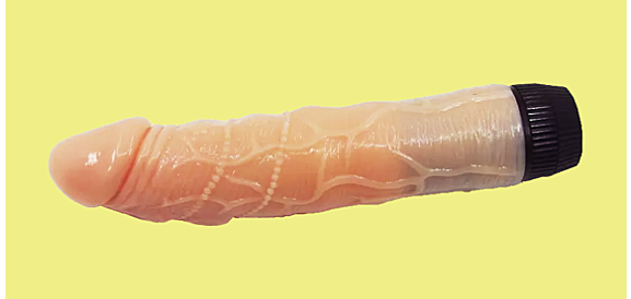 vibrator dildo on yellow background